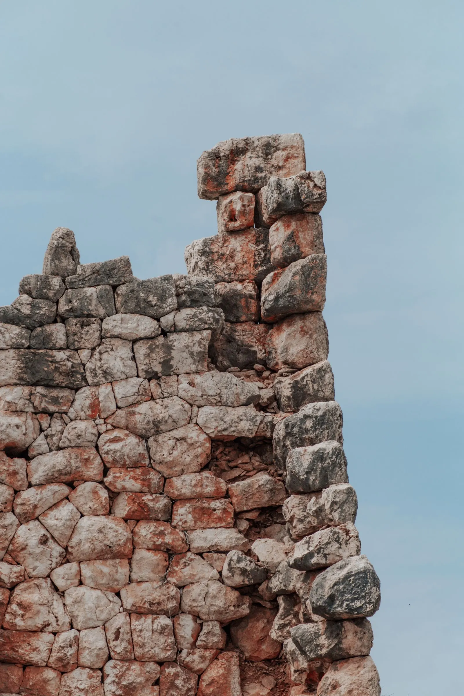 Ancient stone ruins under a clear blue sky